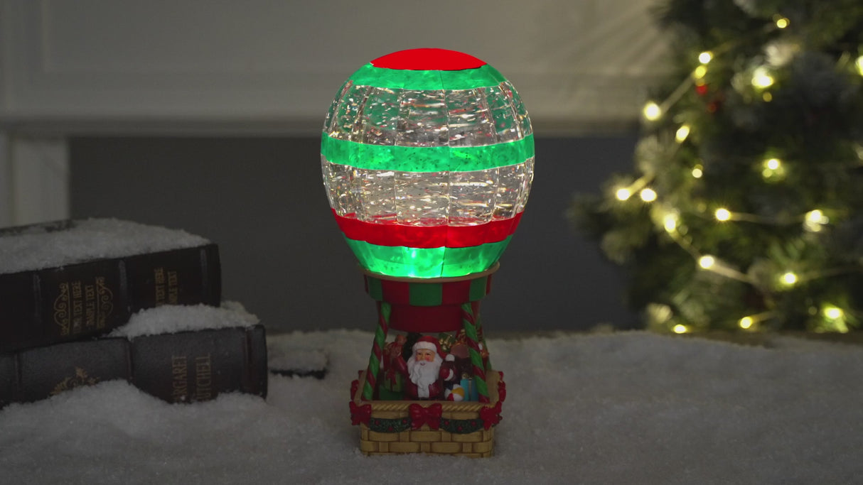 Decoratiune Muzicala - Balon cu aer cald - Mos Craciun, cu apa si sclipici miscator, 25.5 cm