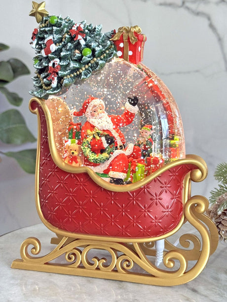 Decoratiune Muzicala - Sania lui Mos Craciun ,cu apa si scilipici miscator, 24 cm